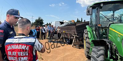 BUĞDAY YÜKLÜ RÖMORKUN ALTINDA KALAN İŞÇİ HAYATINI KAYBETTİ